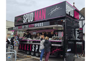 Spud Man jacket potato street food van with queues in the UK
